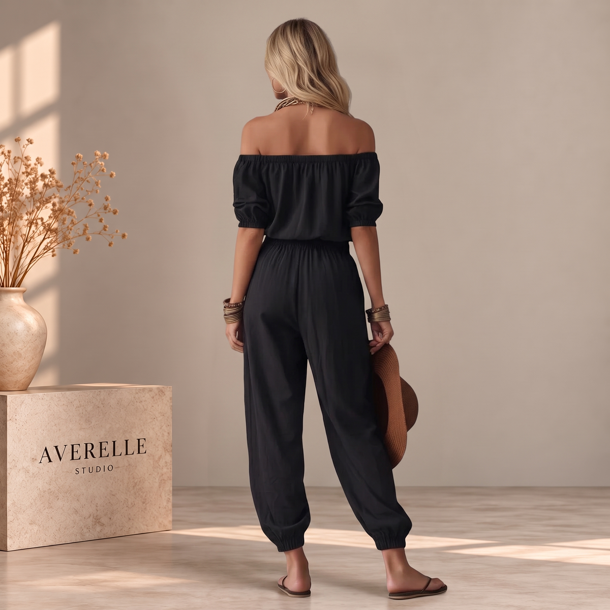 MARBELLA| MONO NEGRO CON HOMBROS AL AIRE Y CORDÓN AJUSTABLE